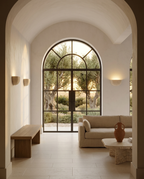 Two Wabi-Sabi Travertine Wall Sconces mounted symmetrically in Mediterranean villa living room