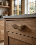 Antique Bronze Drawer Pull, Zinc Alloy — mounted in situ on a luxury kitchen cabinet drawer, warm morning light