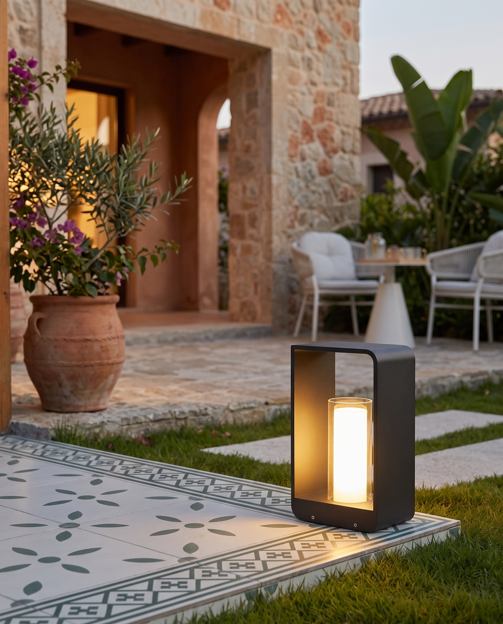 Solar LED Outdoor Lawn Light, Die-Cast Aluminum — at a villa patio edge in the evening