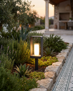 Solar LED Outdoor Lawn Light, Die-Cast Aluminum — staked in a garden bed for scale