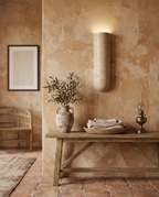 Travertine Stone LED Wall Sconce, G9 — placement and scale, warm Grecian interior with console and decor