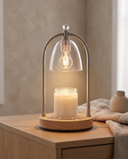 Wood and Glass Candle Warmer Lamp, Timer — hero on a side table, modern minimal living room, soft warm downward glow onto the candle below