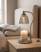 Wood and Glass Candle Warmer Lamp, Timer — three-quarter alt angle, serene bedroom corner, curved glass shade and slender steel arm