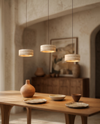 Travertine Stone LED Pendant Light, Dimmable — over a dining table in a Mediterranean villa interior with a warm downward glow