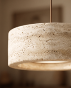 Travertine Stone LED Pendant Light, Dimmable — macro detail of the natural cream travertine grain in warm side light