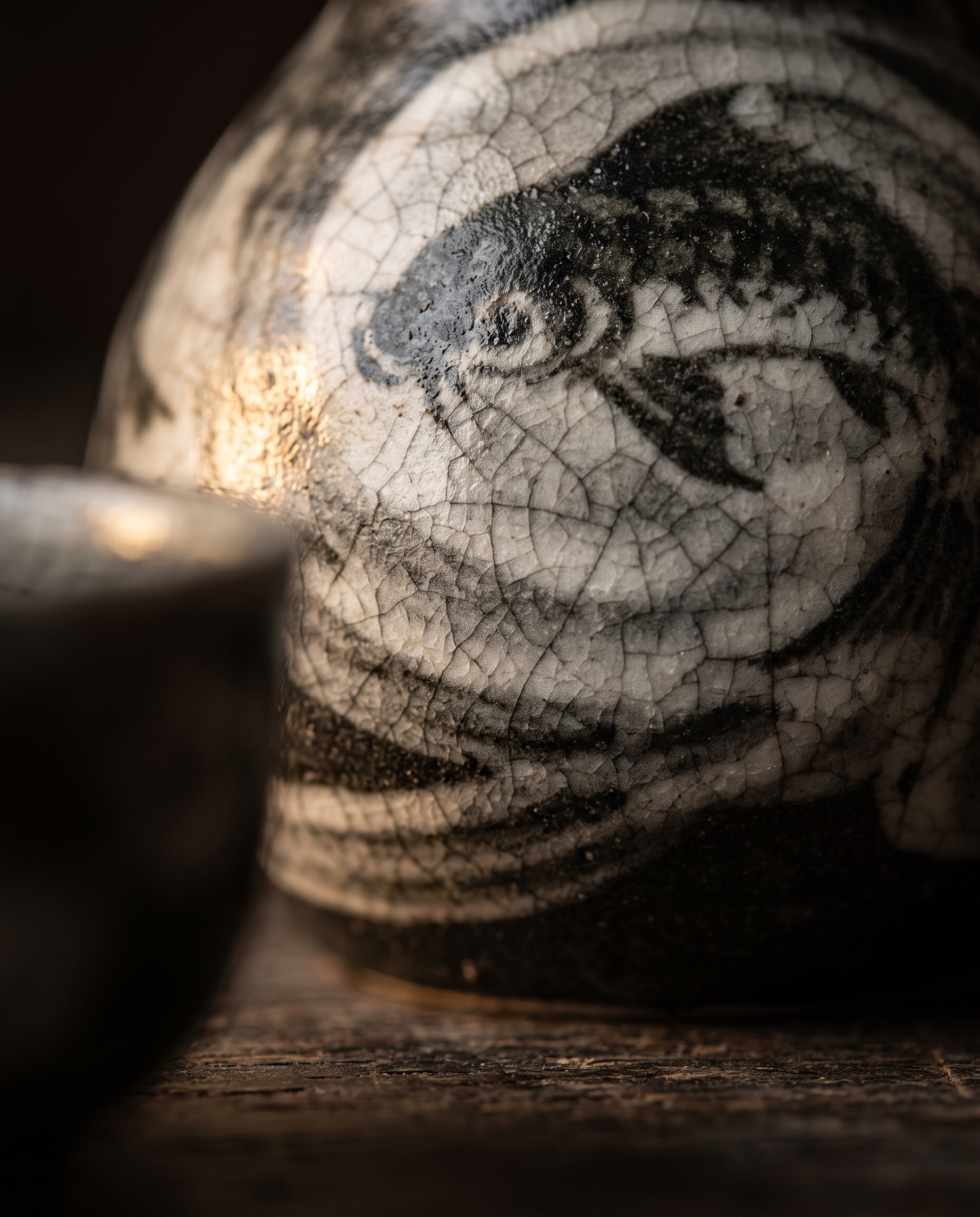 Ceramic Sake Pot and Cup Set, Hot or Cold — macro detail of the ceramic glaze, warm raking side light