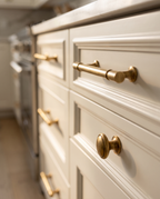Brass Round Knobs and T-Bar Pulls, Solid Brass — mounted pulls, kitchen cabinet drawer, low side-angle profile view