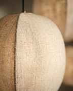 Linen Lantern Pendant Light, Fabric Shade — macro detail of woven linen shade texture, warm side light