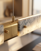 Marble Linear Pendant Light, Gold Wedge LED — macro detail, natural marble grain and brass accents, warm side light