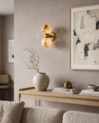 Marble Dual-Globe Wall Lamp, Gold Finish — placement and scale with console and art