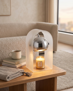 Frosted Glass Candle Warmer Lamp, Silver Finish — full lamp with books and mug for scale, modern living room side table
