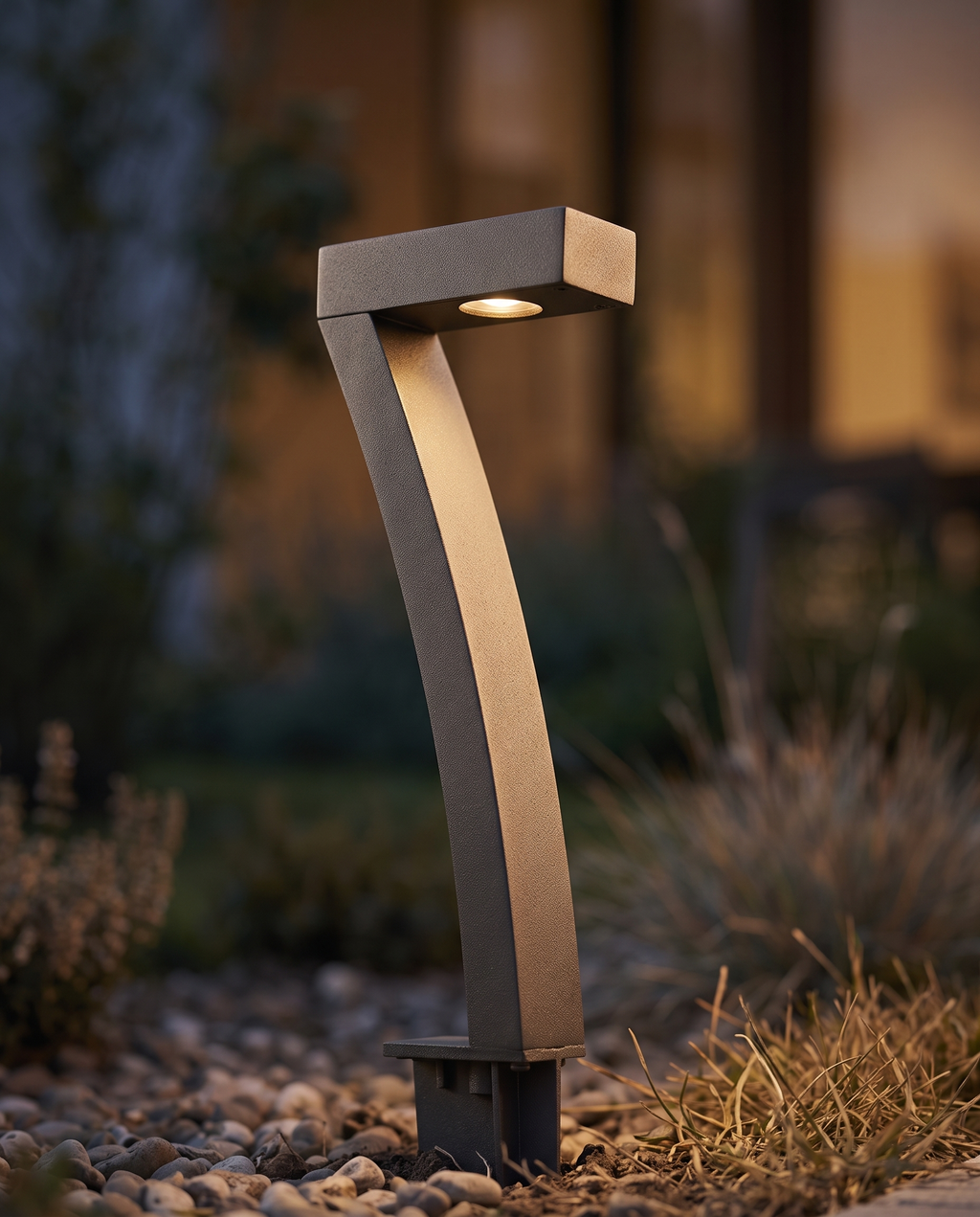 Solar Garden Path Lights, ABS Dusk-to-Dawn — macro detail of a single light's finish and form, warm side light at dusk
