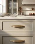 Brushed Brass Cabinet Pull, Antique Finish — hero, kitchen cabinet drawer, mounted in situ