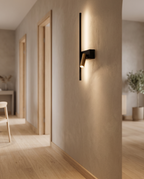 Minimalist Iron LED Wall Light, Nordic — mounted in a Nordic hallway, light oak floor, warm ambient glow