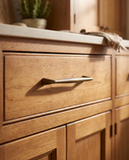 Antique Bronze Cabinet Handles and Knob, Zinc Alloy — mounted on a vintage kitchen cabinet drawer in warm honey wood
