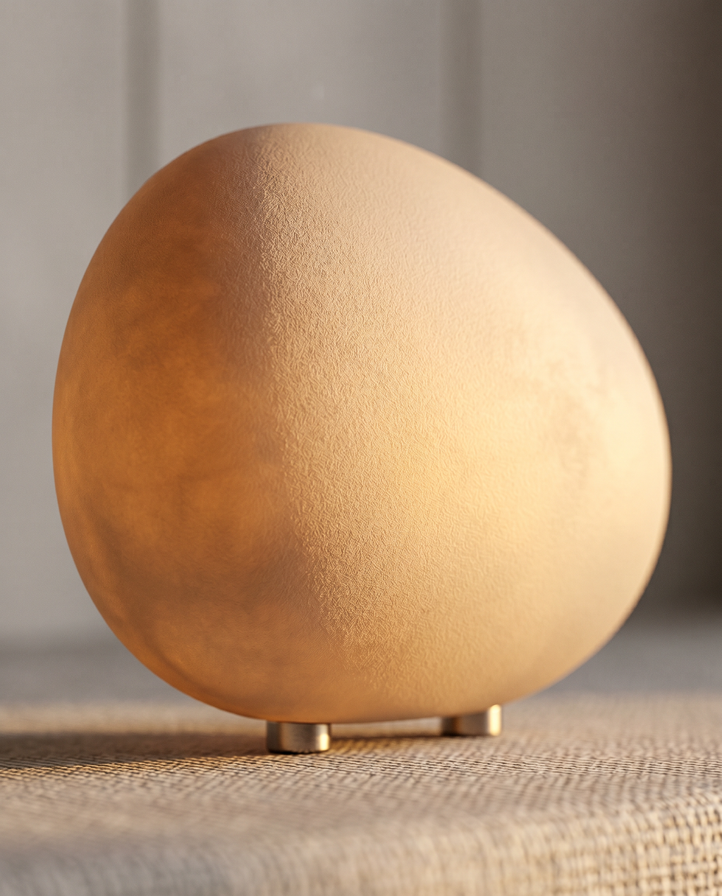 Pebble-Shaped LED Bedside Night Light — macro detail, smooth pebble form and warm inner glow
