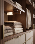 Magnetic Motion Sensor LED Night Light, Rechargeable — mounted inside a walk-in wardrobe with soft warm glow over folded clothing