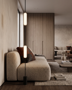 Linear LED Floor-to-Ceiling Lamp, Dimmable — hero standing beside sofa, modern luxury living room, glowing softly