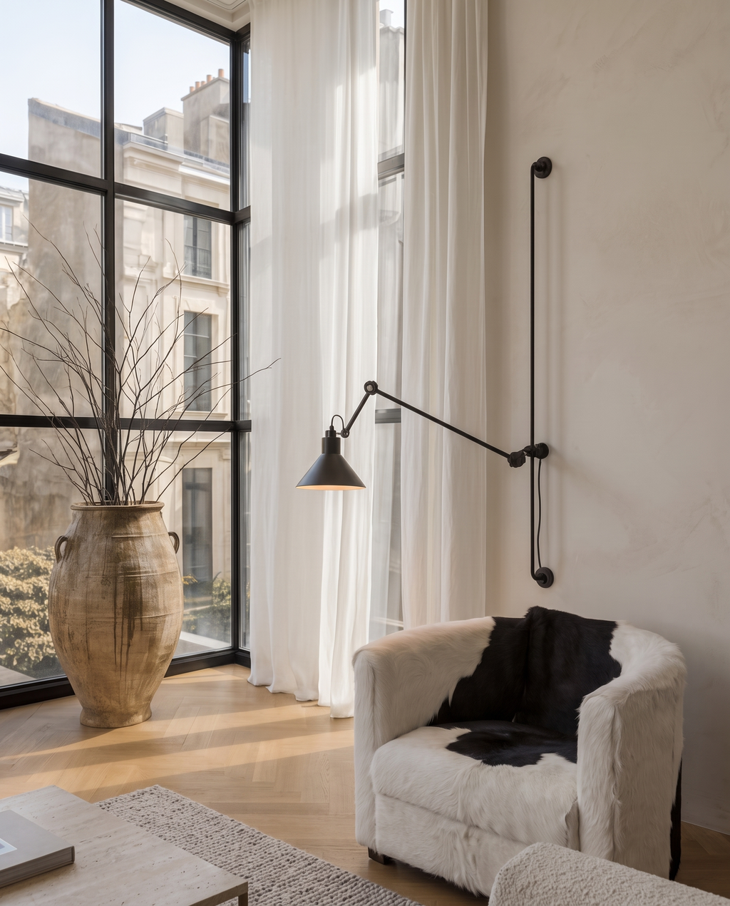 Black Iron Swing Arm Wall Light, Adjustable — placement and scale view, wall-mounted in a modern interior with surrounding furniture