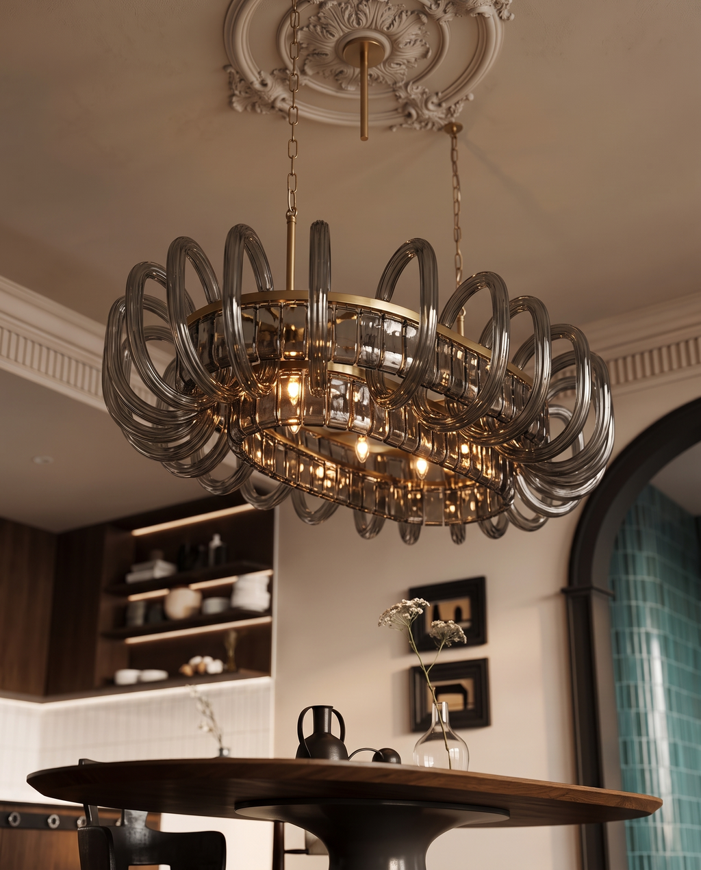 Gray Glass Oval Chandelier, Stainless Steel — alternate angle, Parisian interior, curved gray glass arms in warm light