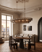 Gray Glass Oval Chandelier, Stainless Steel — wider placement and scale, Parisian living room, tall ceilings and aged wood floors