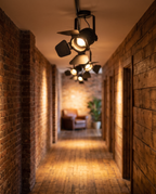 Vintage Spotlight Ceiling Light, Adjustable Iron — in a loft hallway with exposed brick