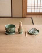 Green Pattern Matcha Tea Ceremony Set, Ceramic and Bamboo — full set contents laid out, Japanese tea room on pale oak, bowl, bamboo whisk, scoop and whisk holder