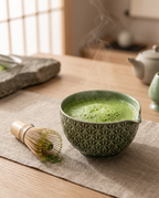 Green Pattern Matcha Tea Ceremony Set, Ceramic and Bamboo — whisked green matcha in the bowl, calm zen kitchen on a linen runner over pale oak