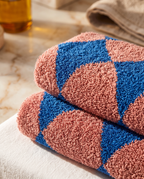 Blue Diamond Pattern Cotton Bath Towel Set — macro cotton weave detail, luxury spa, warm side light