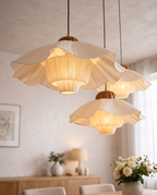 Pleated Petal Fabric Pendant Light, Cream — alternate angle in a modern dining setting, revealing the sculptural layered petals