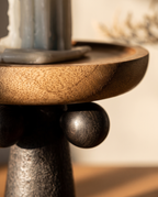 Turned Wood Pedestal Display Tray — macro detail, natural wood grain and turned curves in warm side light