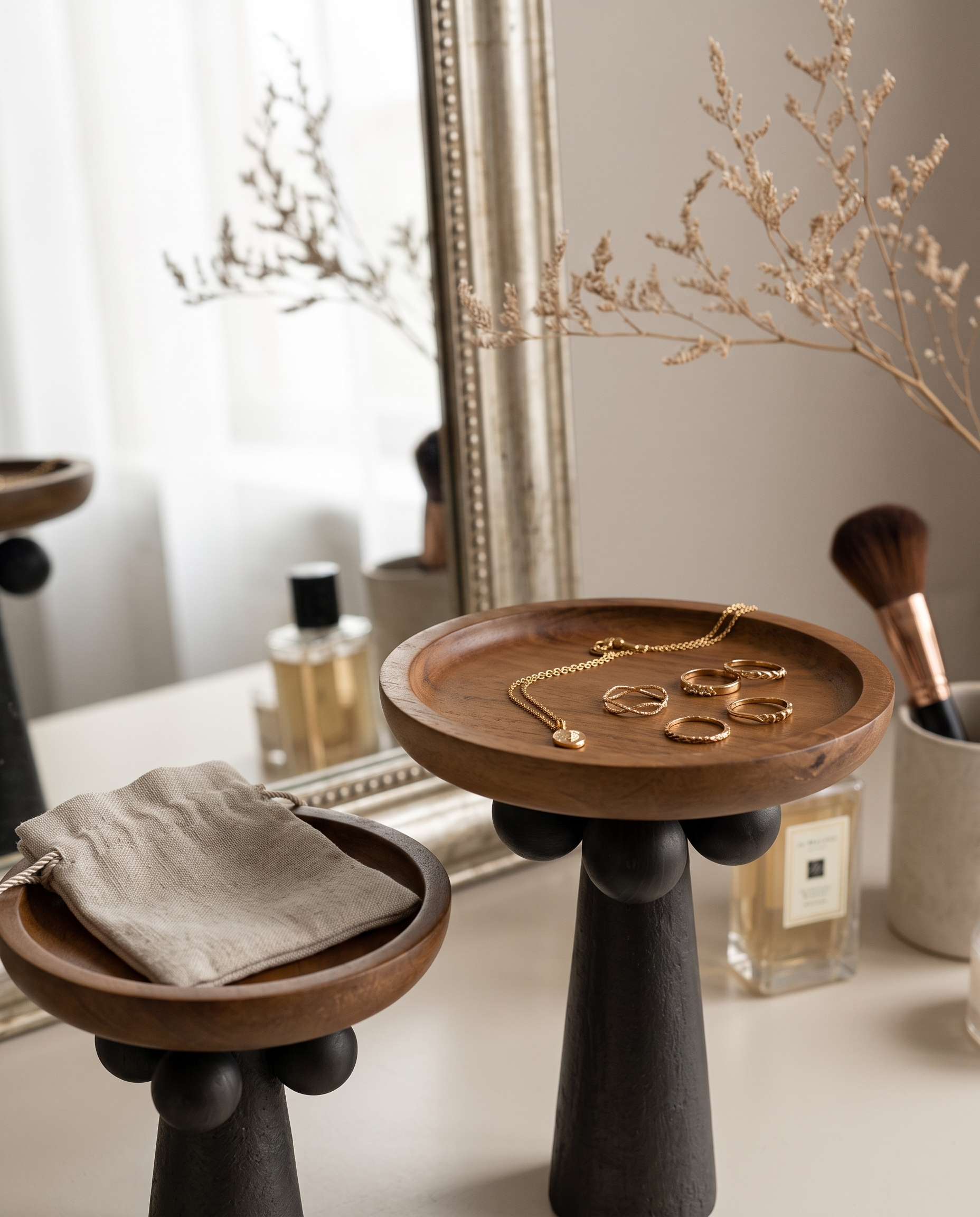 Turned Wood Pedestal Display Tray — on a luxury vanity holding delicate gold jewelry, soft natural light