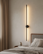 Linear LED Wall Lamp, Minimalist Aluminum — Black, mounted on a bedroom wall