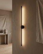 Linear LED Wall Lamp, Minimalist Aluminum — Black, mounted in a minimalist hallway