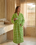Dotted Jacquard Organic Cotton Bathrobe — Green, adult model wearing the robe, luxury spa hotel bathroom