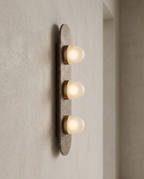 Minimalist Glass and Stone Wall Sconce, Copper — alternate angle showing 3D form, neutral wall