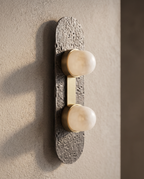 Minimalist Glass and Stone Wall Sconce, Copper — detail macro of glass and metal, warm side light