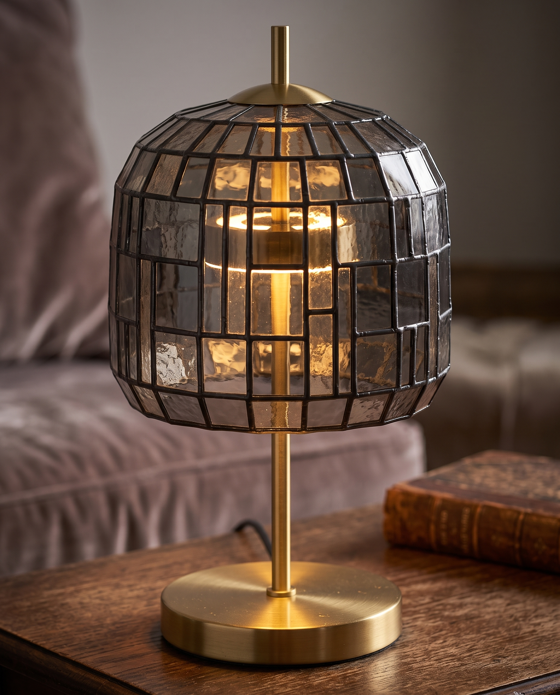 Stained Glass Table Lamp — macro detail of stained glass shade and gold iron base, warm side lighting