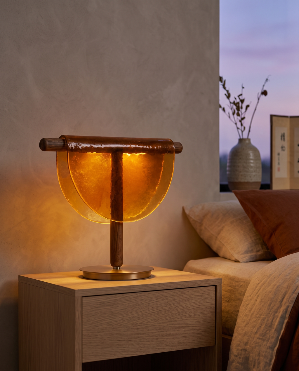 Half-Moon Amber Glass Table Lamp, LED — mood shot on oak nightstand, calm Japandi bedroom at evening