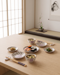 Cherry Blossom Sushi Dinnerware Set — Purple hero, pale oak Japanese dining table in a calm minimal zen dining room