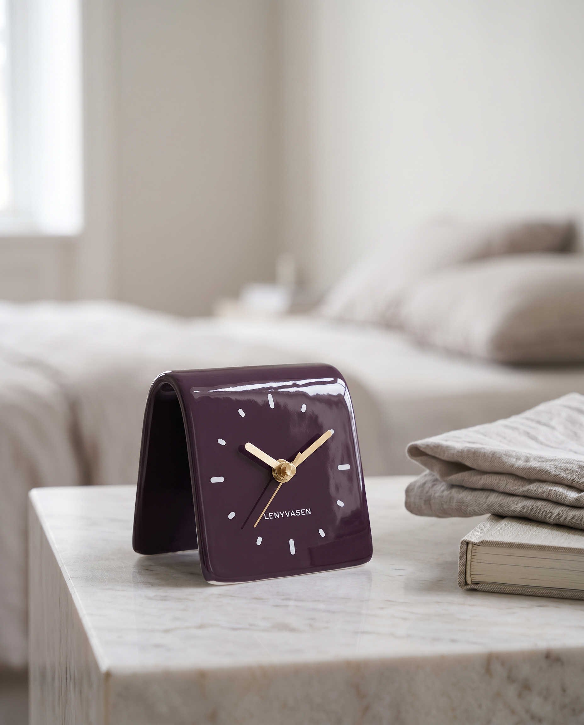 Square Ceramic Desk Clock, Silent — Glossy Purple, on a pale marble bedside table in a serene minimal bedroom