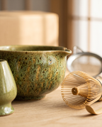Kiln-Glazed Matcha Ceremony Set, 5-Piece Ceramic and Bamboo — macro detail of the kiln-transformed glaze and bamboo whisk in soft light