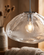 Sculpted Cloud Glass Pendant Light, LED — macro detail of the Clear sculpted glass shade, warm side light