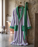 Yarn-Dyed Stripe Organic Cotton Bathrobe — on a wooden hanger with natural folds, luxury spa bathroom