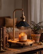 Retro Wax Warmer Lamp, Wood and Metal — Black, on living room shelf with books and plant at evening