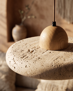 Travertine and Wood Pendant Light, LED — macro detail of travertine stone meeting light oak wood, warm Japandi backdrop