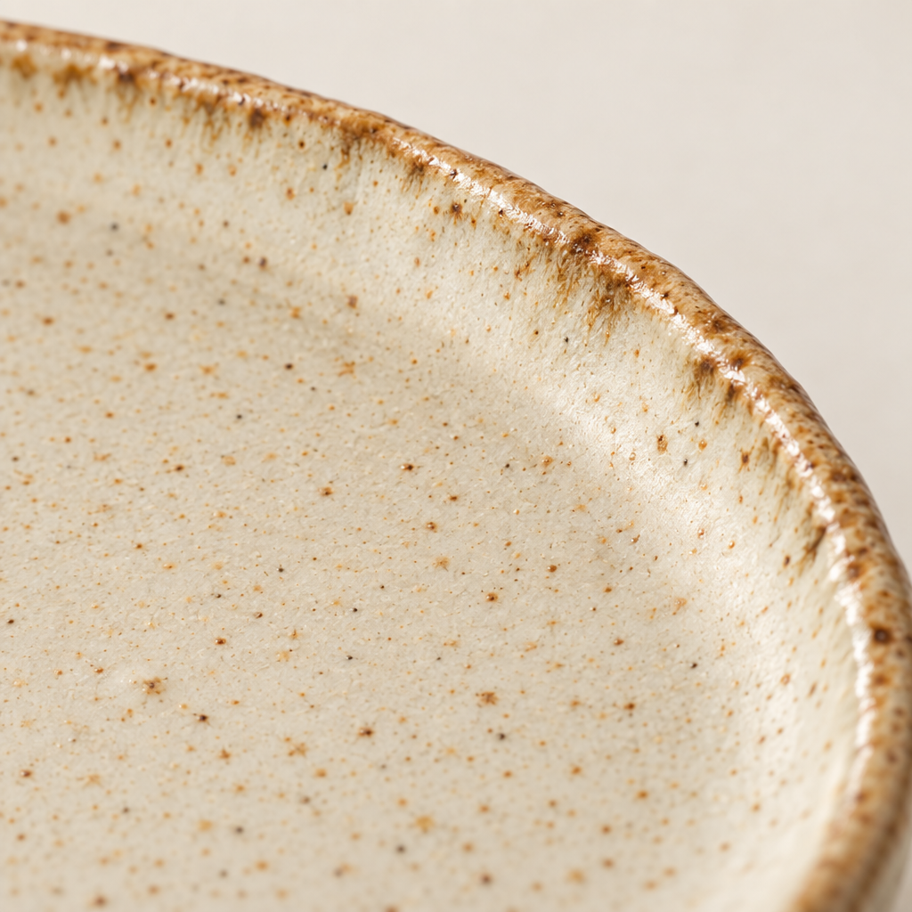 Close-up of the reactive glaze pooling at the rim