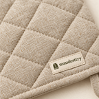 Close-up of the quilting and woven Maudestry label