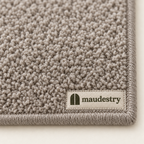 Close-up of the tufted pile and woven Maudestry label