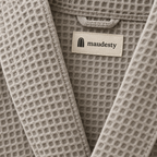 Close-up of the waffle weave and woven Maudestry label